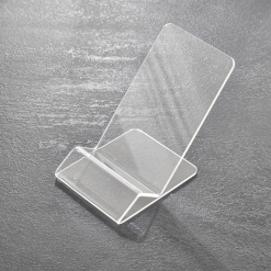 Suport telefon din plexiglas transparent Suport de telefon din plexiglas transparent, cu design minimalist și stabilitate excelentă. Ideal pentru birou sau expunere în vitrină, compatibil cu majoritatea smartphone-urilor.